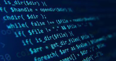 Blue code on a dark background presented at an angle.
