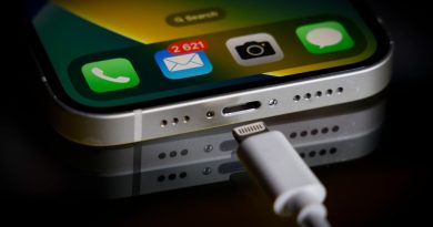 A Apple Lightning port charging cable is seen with with an iPhone in this illustration photo in Warsaw, Poland on 05 October, 2022.