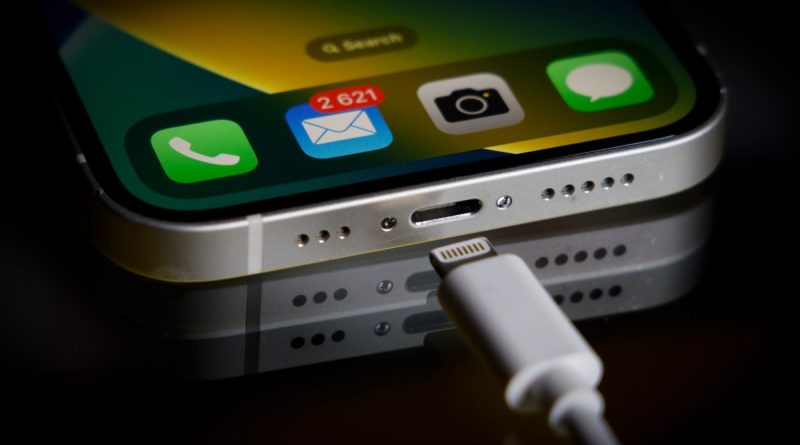 A Apple Lightning port charging cable is seen with with an iPhone in this illustration photo in Warsaw, Poland on 05 October, 2022.