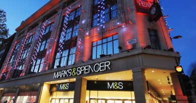 LONDON, ENGLAND - NOVEMBER 26: General view of shoppers walking past the entrance to the Marks & Spencer store on Oxford Street on November 26, 2009 in London, England.