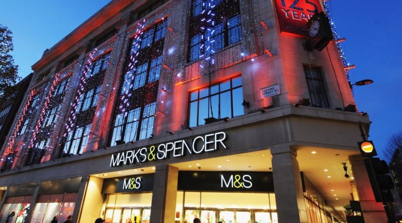 LONDON, ENGLAND - NOVEMBER 26: General view of shoppers walking past the entrance to the Marks & Spencer store on Oxford Street on November 26, 2009 in London, England.